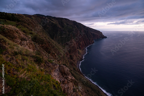 Blue hour over the rocky cliffs on the west coast of Madeira, seen from “Miradouro do Fio” viewpoint near Ponta do Pargo