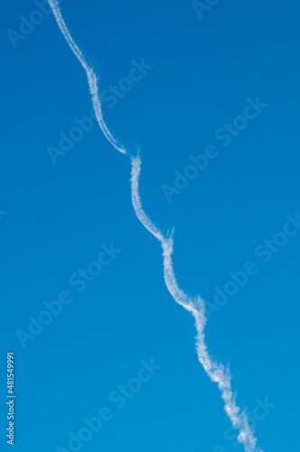 Contrail of an aircraft on a blue sky