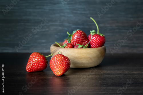 Still life with fresh strawberries on a dark background