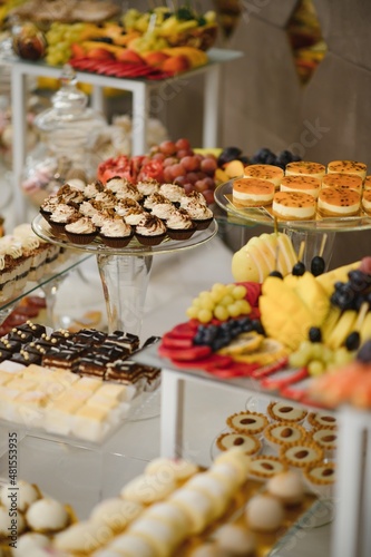 various dessert with fresh fruit on buffet line, sweet