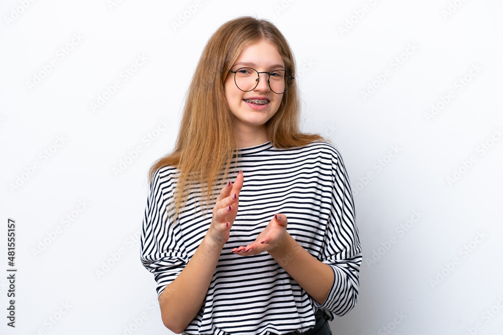 Teenager Russian girl isolated on white background applauding after presentation in a conference Teenager Russian girl isolated on white background applauding after presentation in a conference
