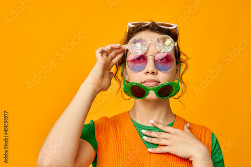 beautiful woman multicolored sunglasses on face posing grimace Lifestyle unaltered