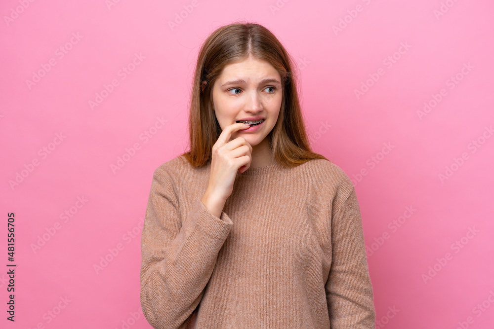 Teenager Russian girl isolated on pink background nervous and scared Teenager Russian girl isolated on pink background nervous and scared