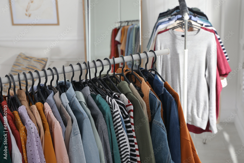 Obraz premium Racks with stylish clothes indoors. Fast fashion