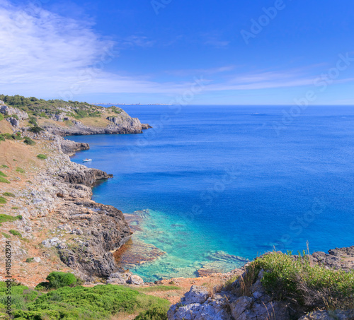 Salento coast: Bay Uluzzo in Apulia, Italy: in the background the skyline of Gallipoli town. Bay Uluzzo is a small natural gulf located within the protected area known as Porto Selvaggio.