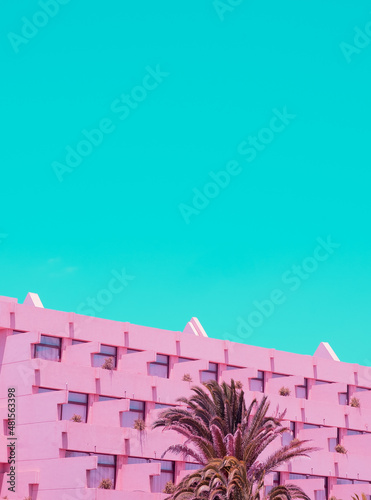 Minimalist building hotel and sky background. Blue and pink colours trends. Travel vacation concept. Stylish wallpaper