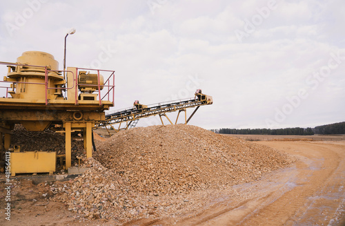 Screening sand and stone in a quarry. Extraction of natural resources.