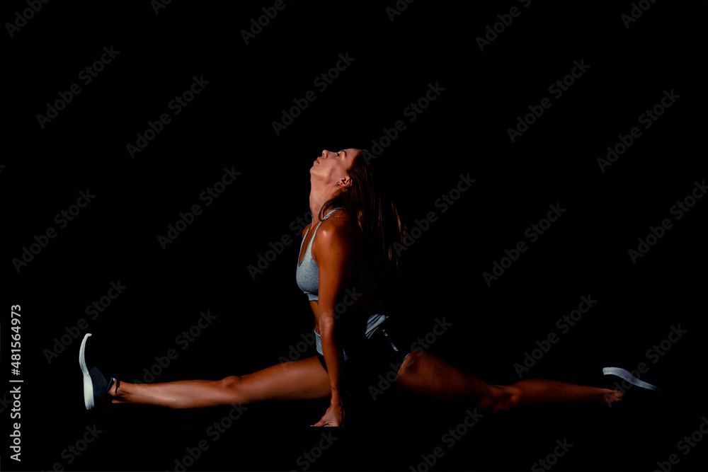 Slim tanned sexy woman's body over black background Slim tanned sexy woman's body over black background