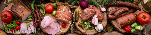 Assortment of cold meats: sausages, ham, bacon
