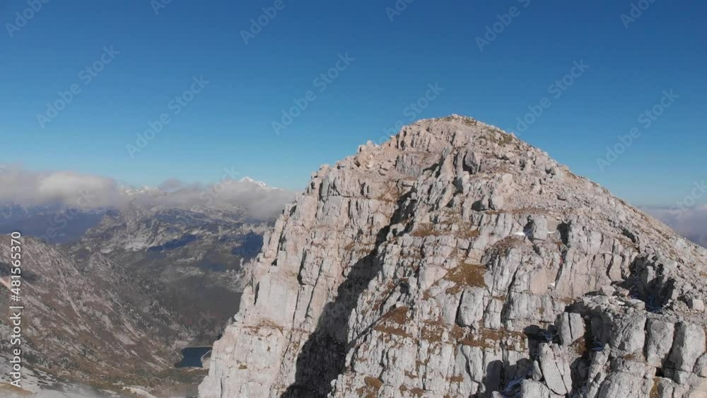 drone lift above mighty mountain peak Krn in Julian Alps, Slovenia, blue sky drone lift above mighty mountain peak Krn in Julian Alps, Slovenia, blue sky