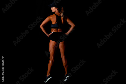 Fitness female woman with muscular body, do her workout. Attractive sexy fitness woman, trained female body, lifestyle portrait, caucasian model.