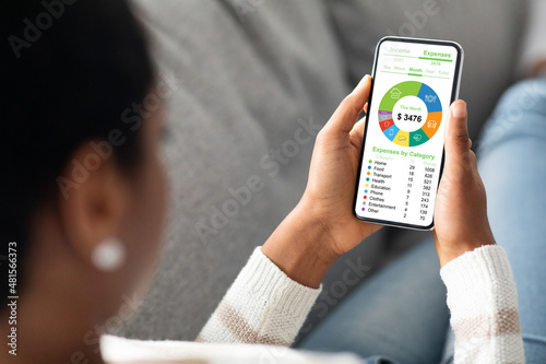 African american lady housewife calculating family budget photo