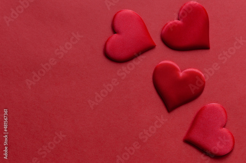 Red background with red hearts, st. Valentine day concept, top view