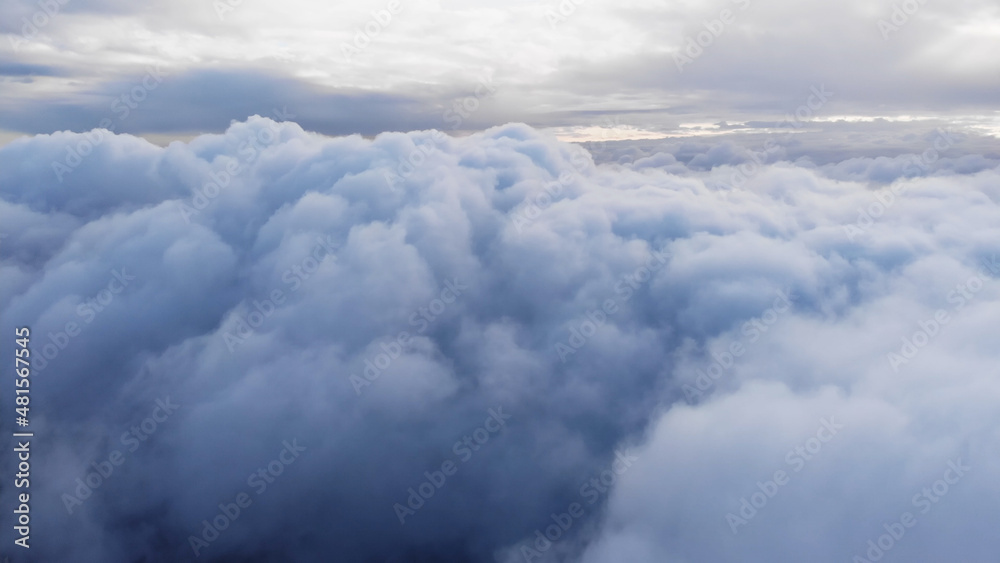 Amazing Aerial Shot: Drone Flying Over Fluffy Blue and White Clouds.