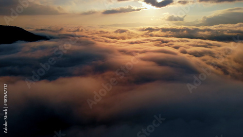 Aerial shot Above Amazing Fluffy Clouds at Morning Time.