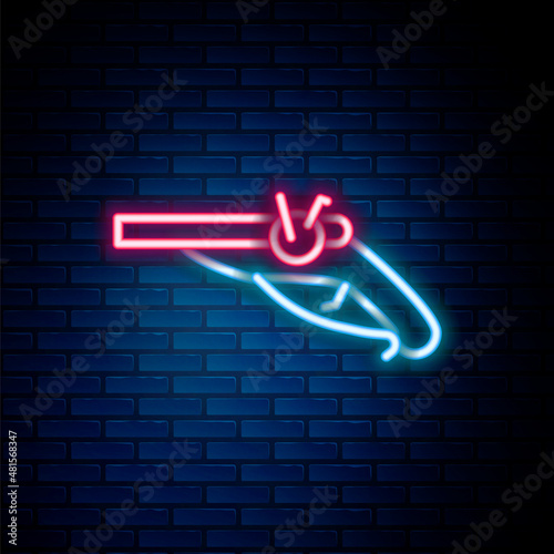 Glowing neon line Vintage pistols icon isolated on brick wall background. Ancient weapon. Colorful outline concept. Vector