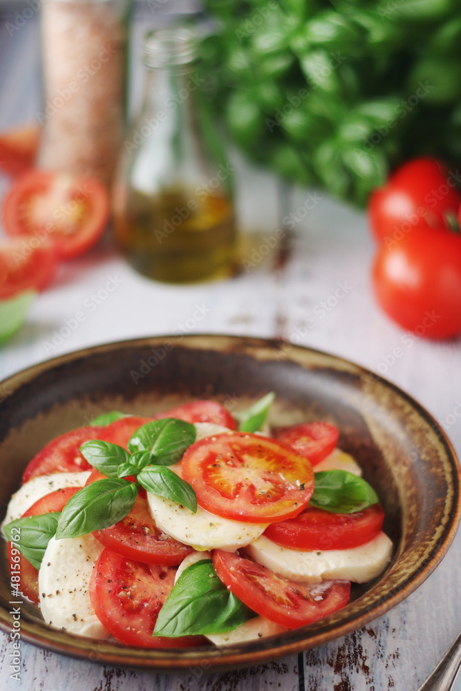 A bowl with traditional Italian caprese salad A bowl with traditional Italian caprese salad