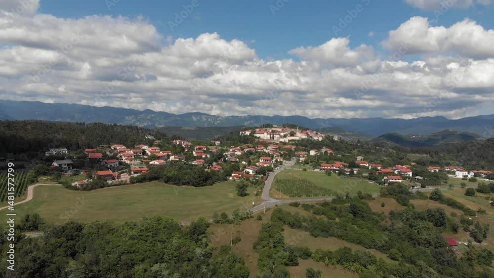 drone fly away from medieval Stanjel village in Karst region, slovenia, summer day drone fly away from medieval Stanjel village in Karst region, slovenia, summer day