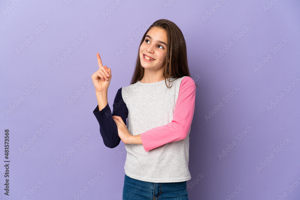 Little girl isolated on purple background pointing up a great idea Little girl isolated on purple background pointing up a great idea