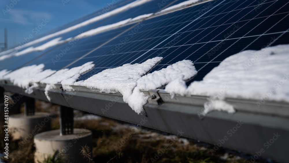 Fototapeta premium snow melting in photovoltaics - energy from the sun