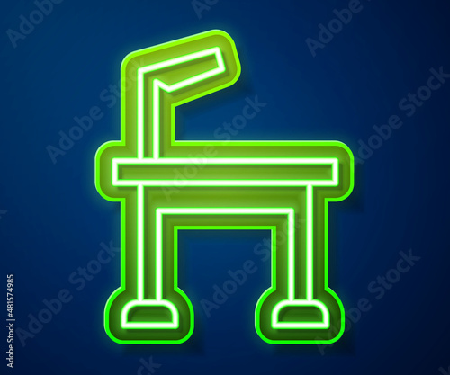 Glowing neon line Pet grooming table icon isolated on blue background. Vector