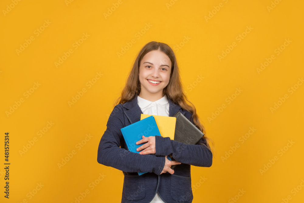 kid hold notebook. student in high school. teen girl do homework with copybook.