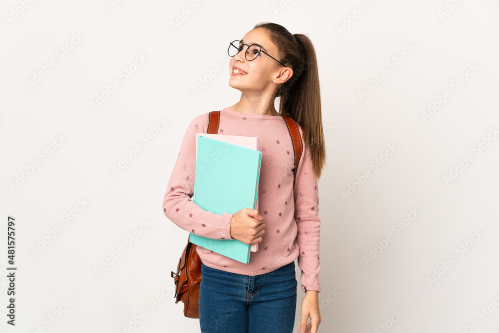 Little student girl over isolated background and looking up Little student girl over isolated background and looking up