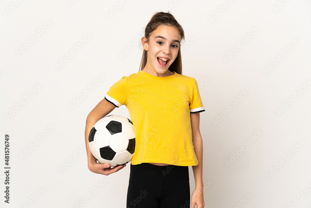 Little football player girl isolated on white background with surprise facial expression Little football player girl isolated on white background with surprise facial expression