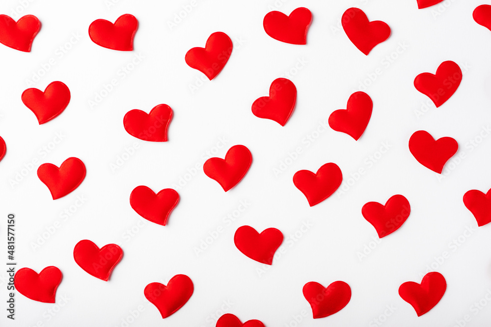 Seamless pattern of red hearts on white background.