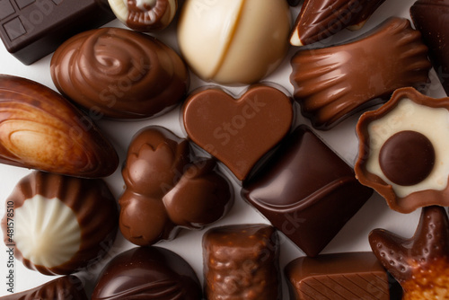Variety of chocolates isolated on white background.