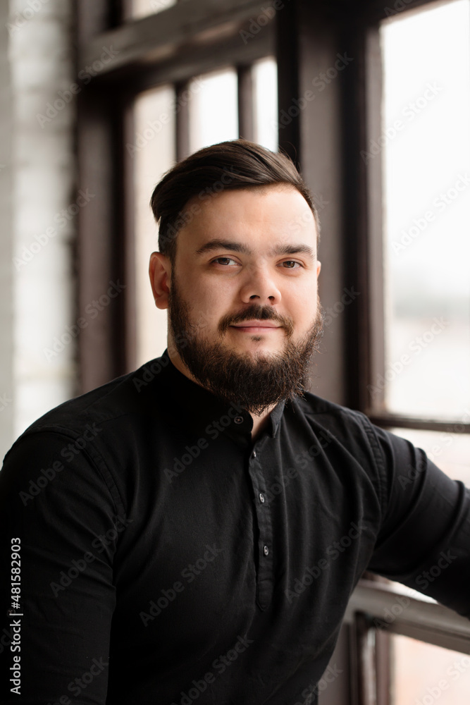 Obraz premium The man at the window
