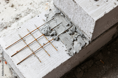 retaining wall and reinforcement construction from expanded clay blocks with stainless mesh photo