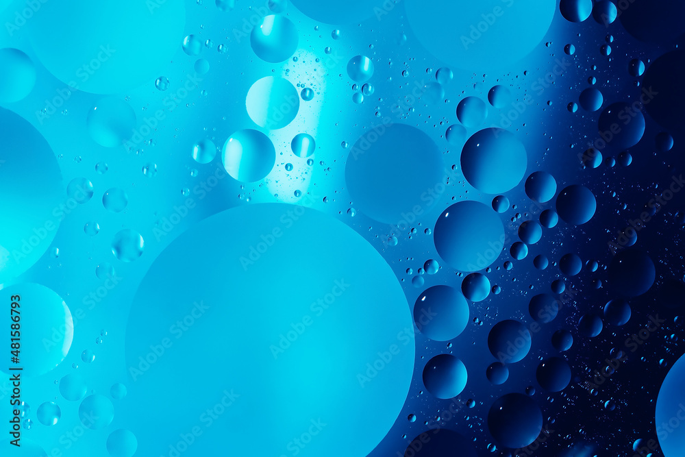 oil with bubbles on dark blue background. Abstract space background. Soft selective focus. macro of oil drops on water surface. copy space. air bubbles in water oil with bubbles on dark blue background. Abstract space background. Soft selective focus. macro of oil drops on water surface. copy space. air bubbles in water