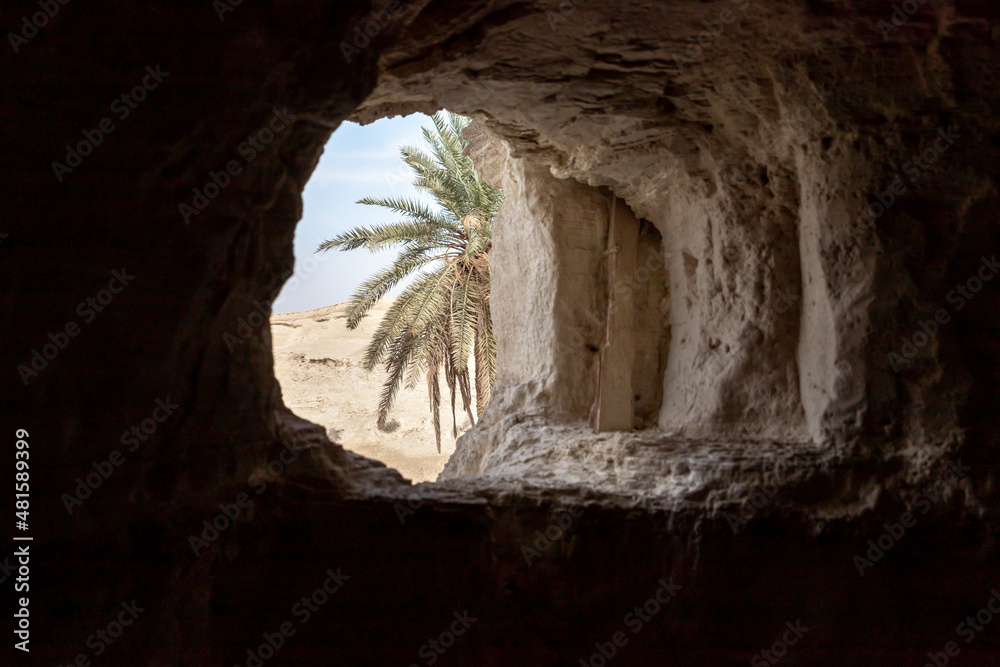 The window  from the cave of the hermits are located near the Deir Hijleh Monastery - Monastery of Gerasim of Jordan in the Judean Desert in Israel