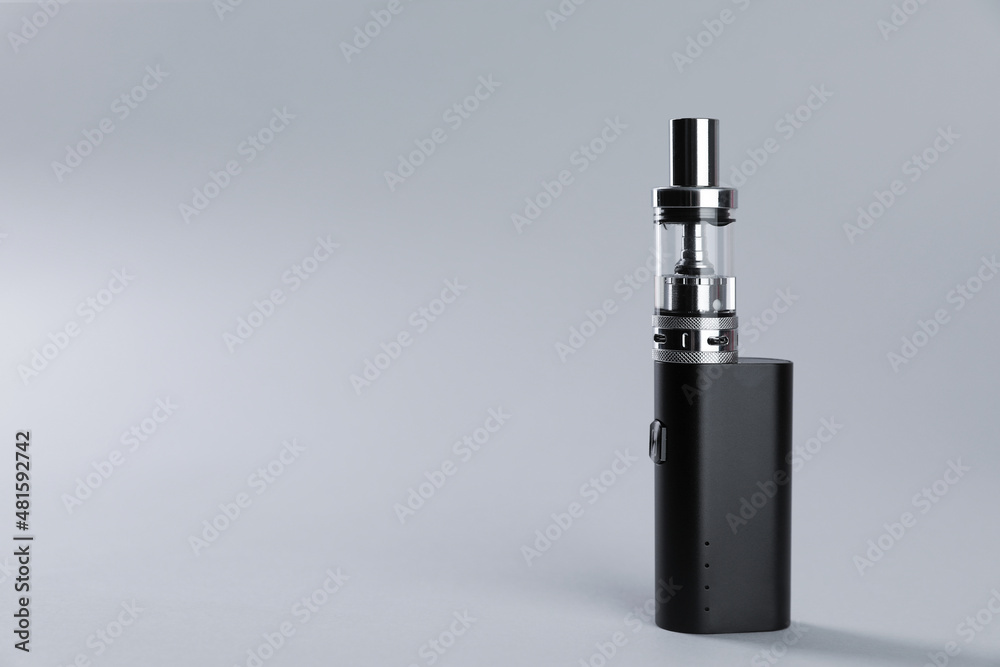Electronic cigarette on light background, space for text Electronic cigarette on light background, space for text