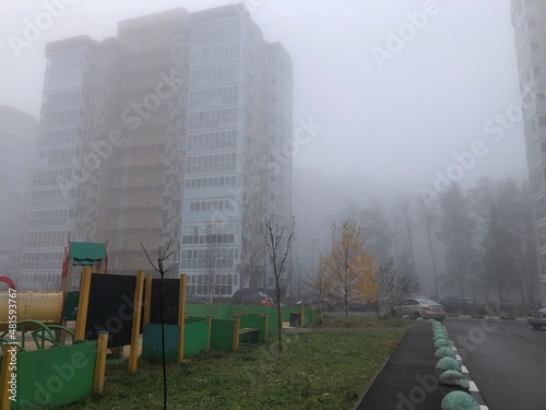 Heavy morning fog and evaporation in the city with high-rise buildings
