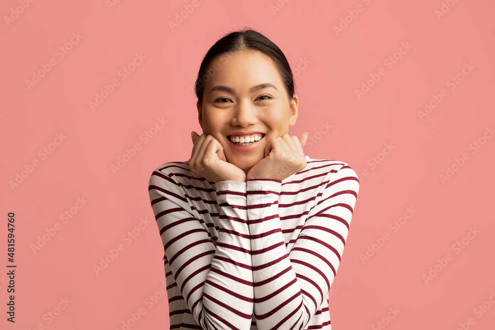 Cute Young Asian Woman Touching Face And Looking At Camera With Excitement Cute Young Asian Woman Touching Face And Looking At Camera With Excitement