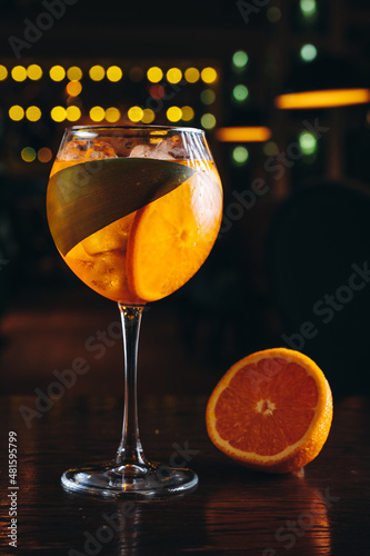 Aperol spritz in a glass with ice and orange