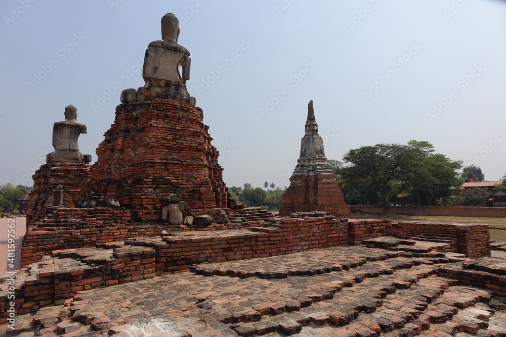 Exploring red brick Wat Chai Watthanaram temple, Ayutthaya, Thailand (horizontal image)