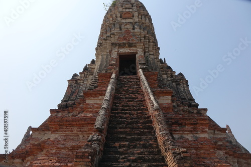 Exploring red brick Wat Chai Watthanaram temple  Ayutthaya  Thailand  vertical image 