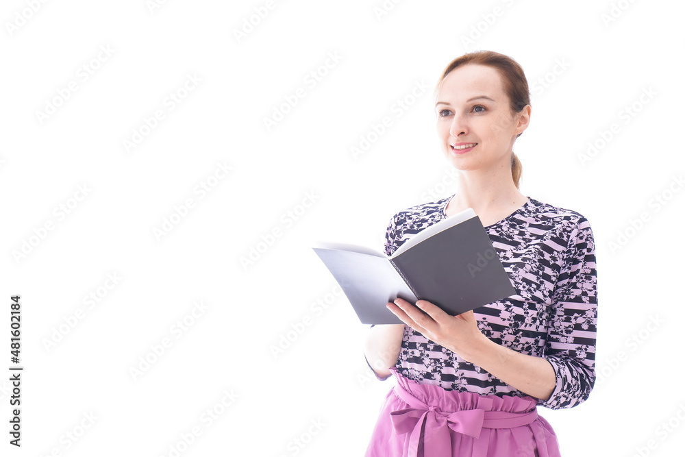 スケジュール帳を確認する若い女性 スケジュール帳を確認する若い女性