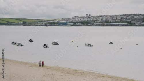 people walking on the beach