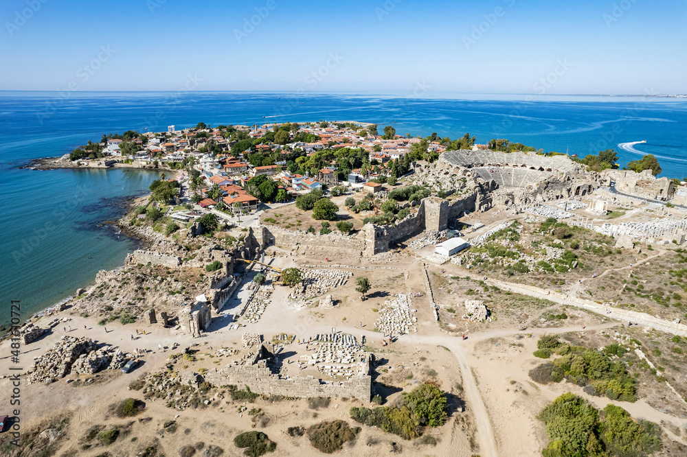 Aerial drone View Of Side Antique City . Side Old Town amphitheater. Side Harbor marina in Antalya Turkey drone photo view
