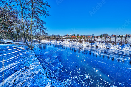 winter scene with frozen river in the Netherlands