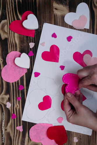 Valentines diy. Step by step instructions for handmade valentine. Craft gift, flat lay. Step 5. Sew the heart of a two-part felt