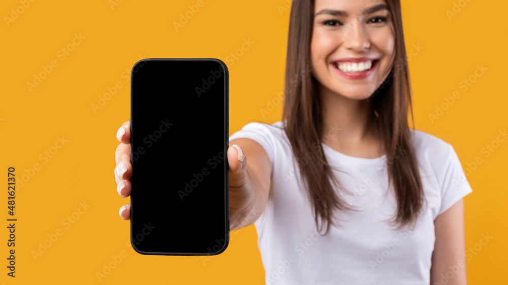 Lady showing white blank smartphone screen close to camera