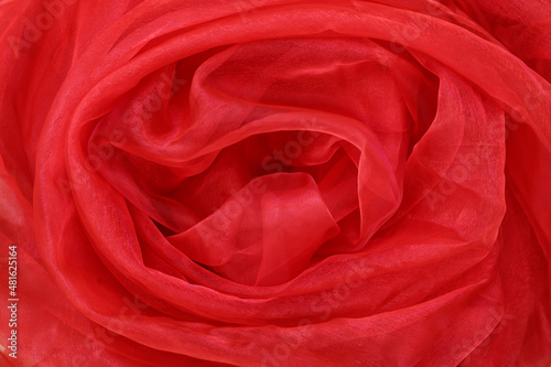 Red background fabric rose. Smooth elegant red silk or satin luxury cloth texture can use as abstract background. Luxurious valentine day background design