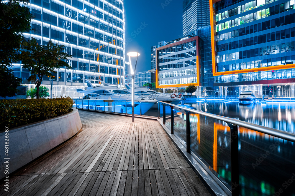 On the waterfront square platform and yacht ship in the urban business district
