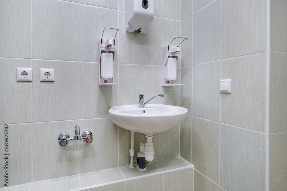 elbow soap and antiseptic dispenser or sanitizer wall mounted for hand disinfection and water tap sink with faucet bathroom or clinic elbow soap and antiseptic dispenser or sanitizer wall mounted for hand disinfection and water tap sink with faucet bathroom or clinic