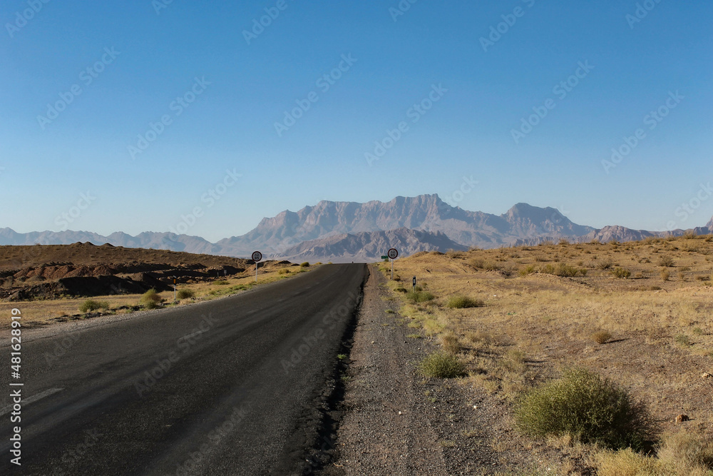 highway in the desert in Iran with suneshine